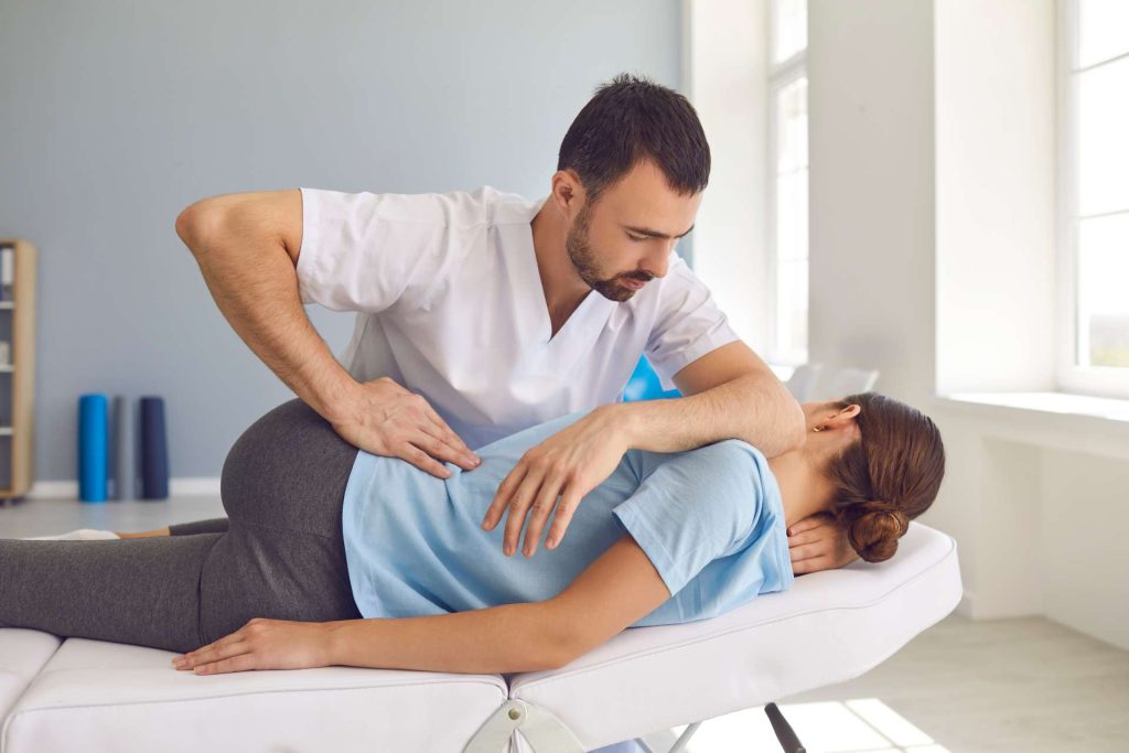 Woman getting osteopathic treatment